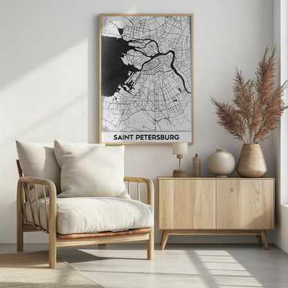 A minimalist black and white framed map of Saint Petersburg. The design features a white landmass with black lines for roads and rivers, contrasting with the solid black sea. The text 'SAINT PETERSBURG' is displayed in a bold, sans-serif font at the bottom of the map. Print