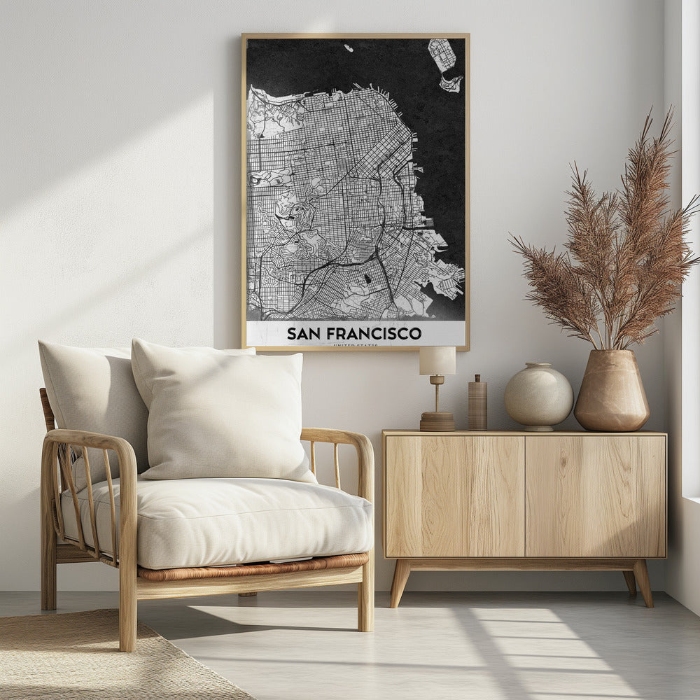 A minimalist black and white art print of a San Francisco city map. The street grid and landmass are depicted in white with fine black lines, set against a solid black background representing the water. A black frame surrounds the map, and a white banner at the bottom displays the text 'SAN FRANCISCO' in a bold, black font. Wall Art