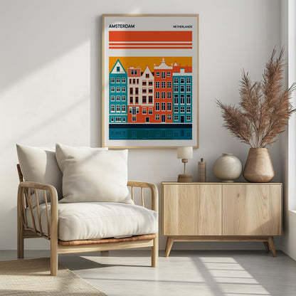 A minimalist travel poster for Amsterdam, Netherlands, featuring a stylized illustration of colorful canal houses in orange, teal, and off-white. The buildings are set against an orange sky and reflected in a dark blue canal below, with the text 'AMSTERDAM' and 'NETHERLANDS' at the top. Decor