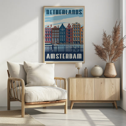 A vintage-style travel poster for Amsterdam, Netherlands. It depicts a row of colorful Dutch canal houses reflected in the water. In the foreground, there are silhouettes of a person walking and a bicycle leaning against a railing. The text 'NETHERLANDS' is at the top and 'AMSTERDAM' is at the bottom in a bold, stylized font. Print