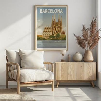 A vintage-style travel poster for Barcelona. The poster features a graphic illustration of the Sagrada Família church reflected in water in the foreground, with 'BARCELONA' written in bold white letters across the top against a blue sky. Poster