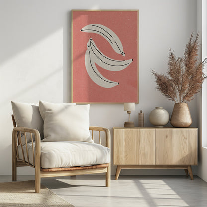 A minimalist illustration of three off-white bananas with black line details, arranged against a textured dusty rose background, all within a thin black frame. Print