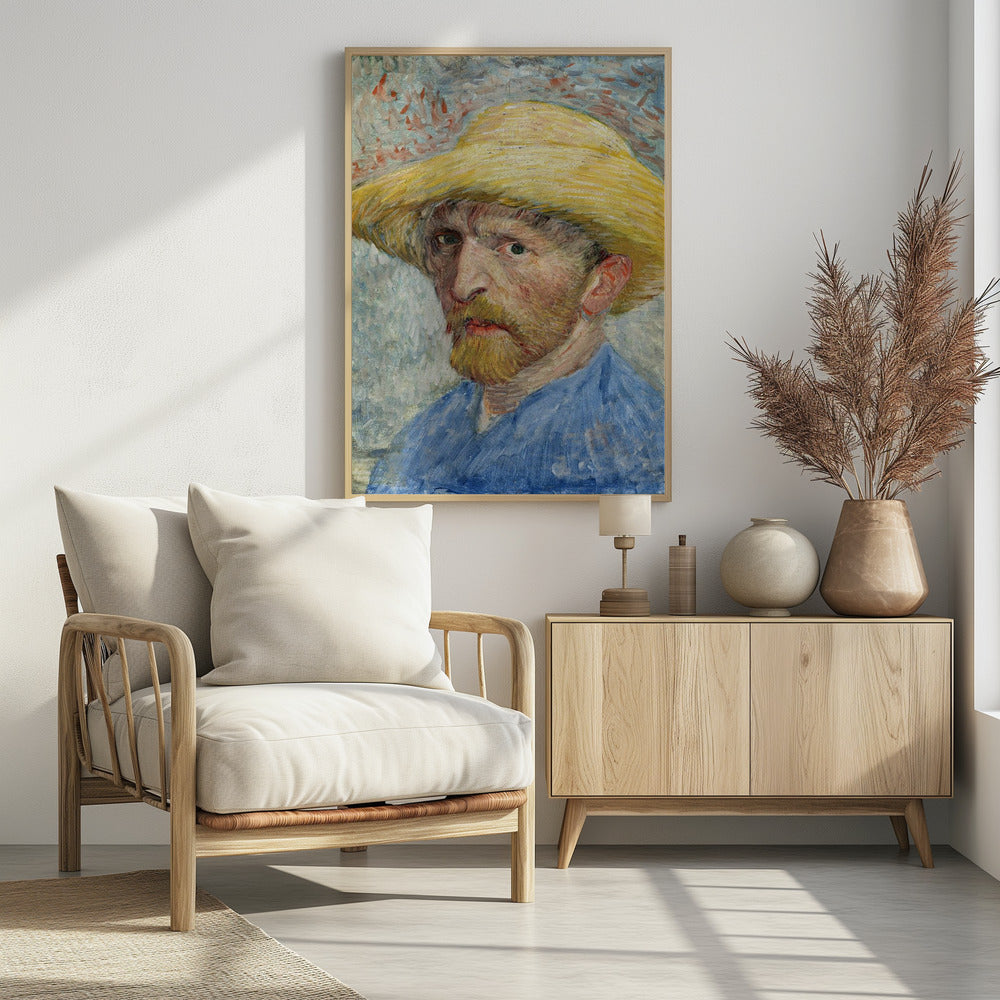 A framed Post-Impressionist self-portrait by Vincent van Gogh. The artist is depicted from the chest up, wearing a vibrant yellow straw hat and a blue smock. He has a reddish-blond beard and an intense, direct gaze. The background is a mix of light blue, white, and red-orange brushstrokes. Artwork