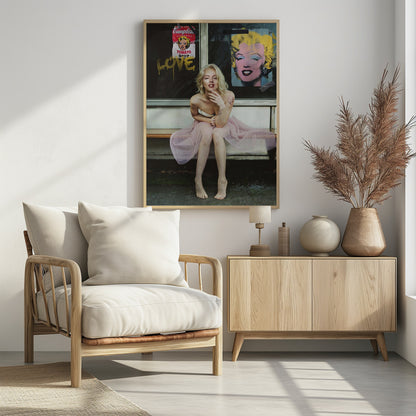 A blonde woman styled like Marilyn Monroe sits on a bench, wearing a pink tulle skirt. Behind her, a dark window features an Andy Warhol-style poster of Monroe, a Campbell's soup can parody, and the word 'LOVE' in gold graffiti. Artwork