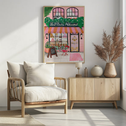 A whimsical illustration of a charming pink French bakery named 'Les Fleurs Patisserie'. A pink and orange striped awning hangs over a window filled with cakes and pastries. A black cat peeks out from a lush green garland above the shop. In front, a small red chair, a chalkboard sign, and an ornate pink door add to the inviting Parisian scene. Print