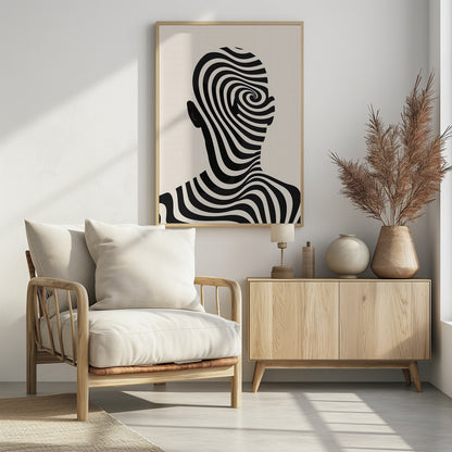 A framed abstract artwork featuring the silhouette of a person's head filled with a hypnotic black and cream spiral optical illusion pattern. The background is a solid cream color. Decor