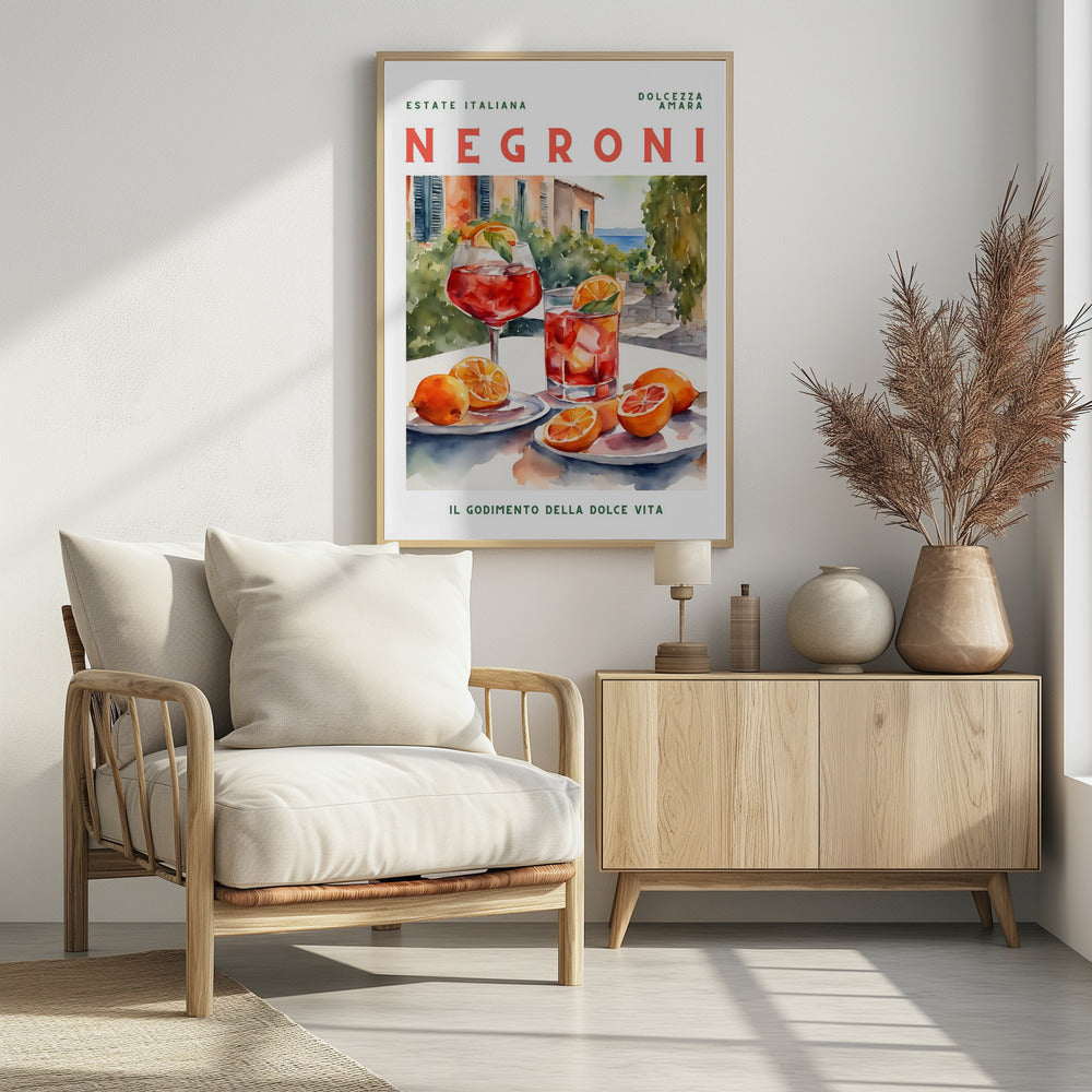 A vintage-style poster for a Negroni cocktail with the words 'Estate Italiana' and 'Negroni' at the top. The poster features a watercolor illustration of two glasses of Negroni on a white table with fresh oranges, set against a sunny Italian coastal backdrop with a villa and the sea. At the bottom, it reads 'Il Godimento Della Dolce Vita'. Artwork