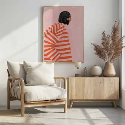 A modern illustration of a woman with short black hair in profile, wearing an oversized sweater with bold orange and light pink horizontal stripes, set against a solid pink background. Artwork