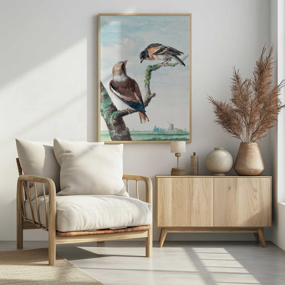 A vintage watercolor painting of two birds perched on branches against a soft blue sky. In the foreground, a Hawfinch with brown and blue feathers sits on a thick branch, while a Brambling with orange, black, and white plumage perches above. A classic Dutch landscape with a windmill is visible in the distant background. Wall Art