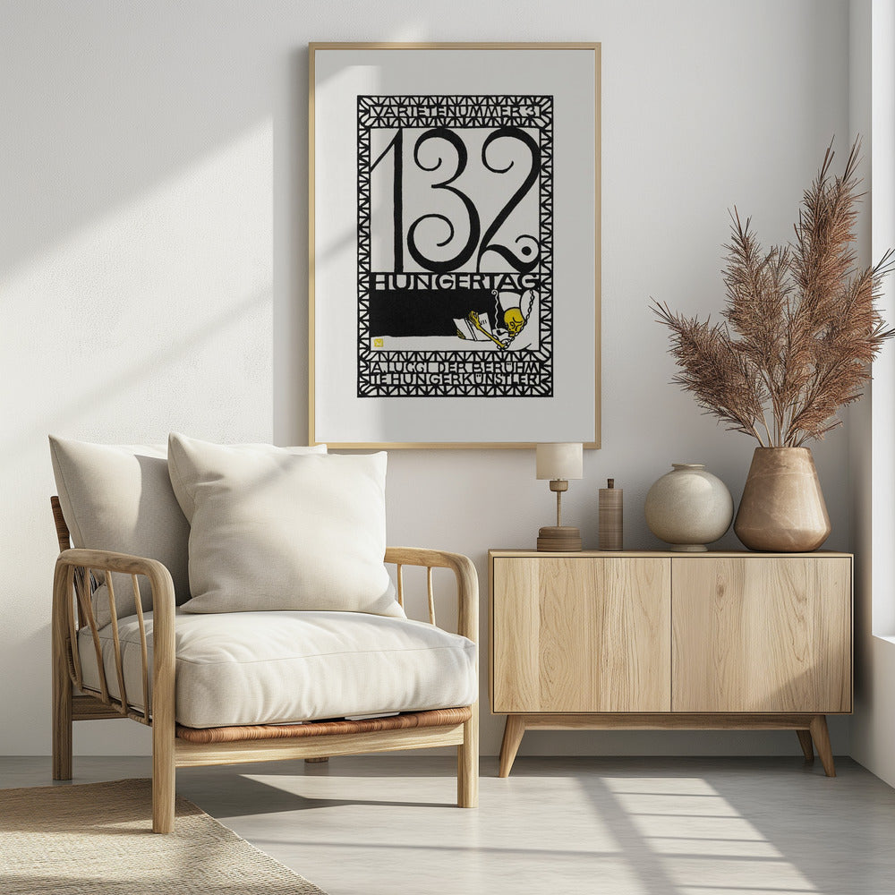 A framed vintage German art print in a graphic, woodcut style. The piece is primarily black and white with a yellow accent, featuring the large number '132' and German text like 'HUNGERTAG'. A small yellow skeleton figure is depicted reading a book and smoking a pipe, all enclosed within a geometric border. Wall Art