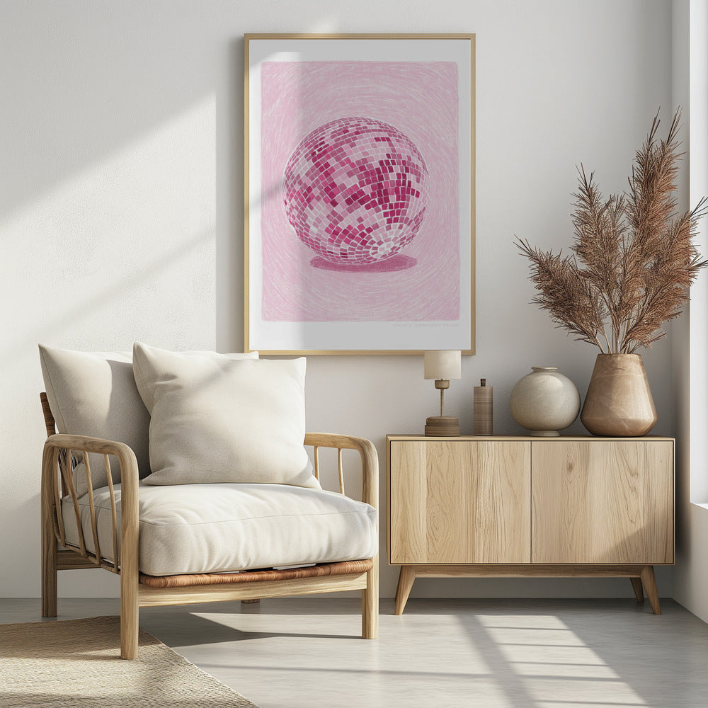 A monochromatic illustration of a disco ball rendered in various shades of pink. The disco ball is centered against a light pink background with a textured, sketchy quality, and it casts a darker pink shadow beneath it. The artwork is shown within a black frame with a white mat. Poster