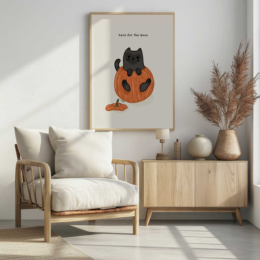 A cute cartoon illustration of a black cat sitting inside a hollowed-out orange pumpkin. Above the cat is the text 'here for the boos' in a simple font against a light beige background. The art is signed 'f.royle'. Artwork
