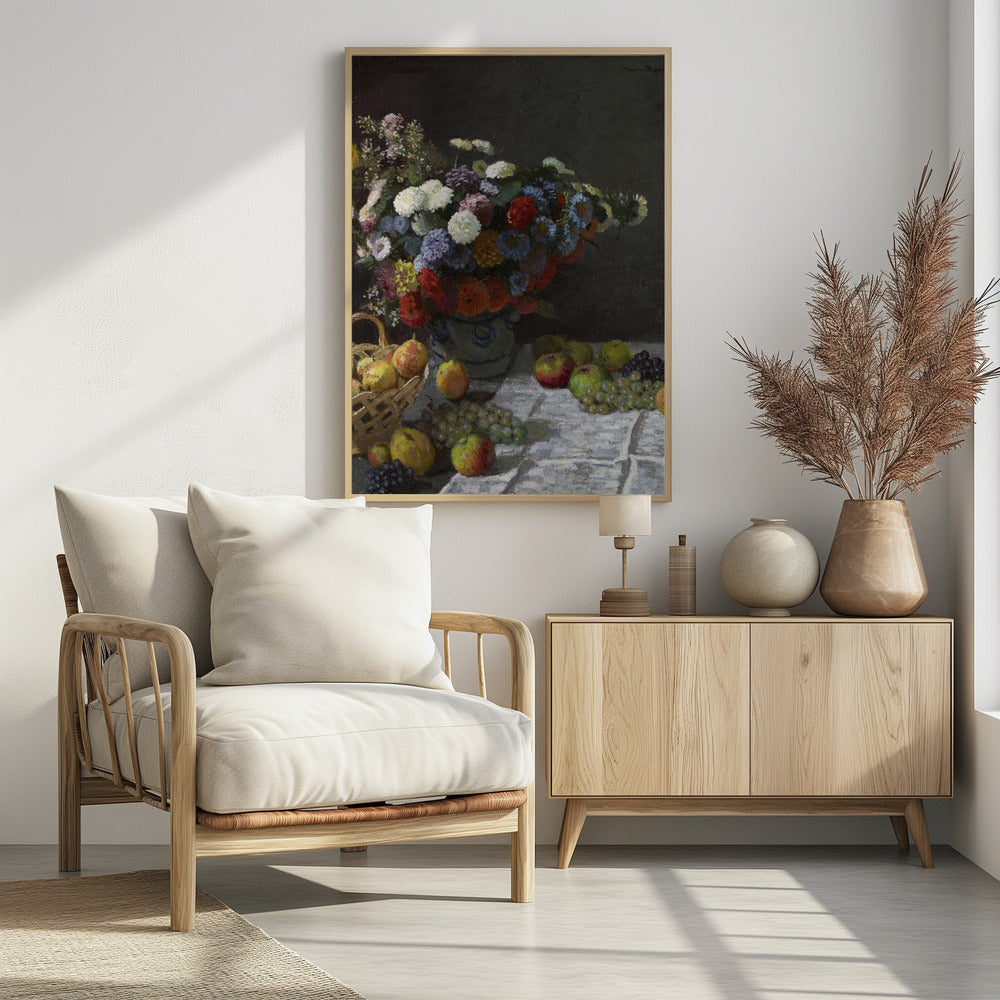 A classic still life painting by Claude Monet depicting a vibrant, multicolored bouquet of flowers in a ceramic vase. Scattered around the vase on a white tablecloth are various fruits, including apples, pears in a basket, and bunches of grapes, all set against a dark, moody background. Poster