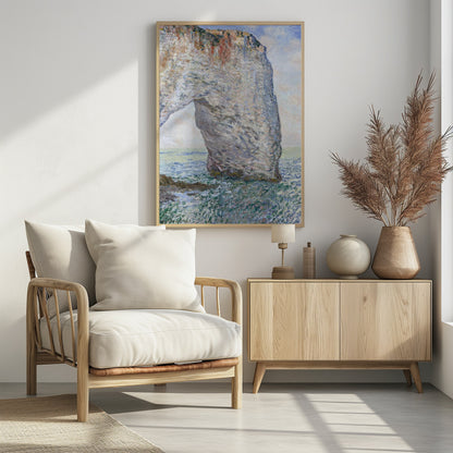 An Impressionist painting depicting a massive white chalk cliff with a natural arch, standing in a turbulent sea of green and blue water. The visible, textured brushstrokes capture the play of light on the rock and water under a bright, cloudy sky. Decor