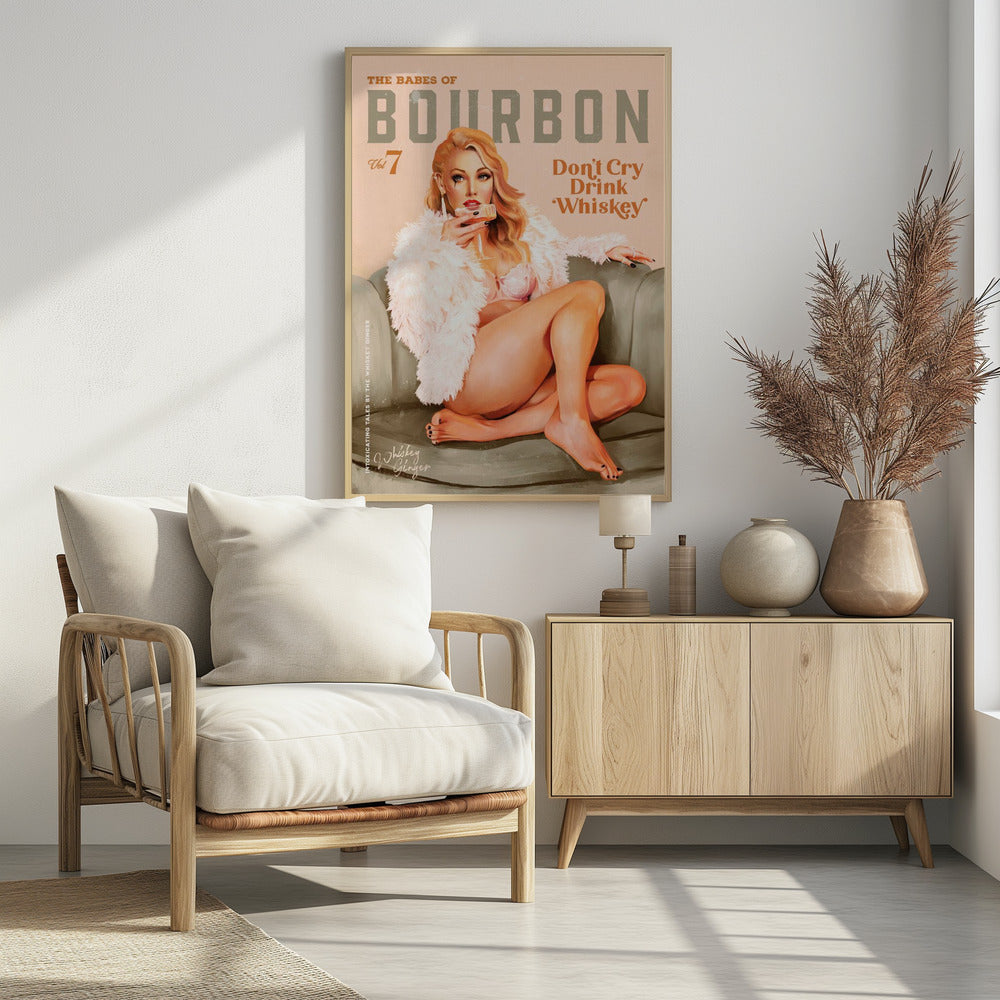 A vintage-style pin-up poster titled 'The Babes of Bourbon, Vol 7'. A glamorous blonde woman in a pink bra and fluffy white coat lounges on a gray-green sofa, holding a glass of whiskey. The poster also has the text 'Don't Cry Drink Whiskey'. Wall Art