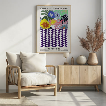 A contemporary art museum poster for Barcelona, featuring a split design. The top half shows a colorful abstract floral pattern with blue, yellow, pink, and green flowers. The bottom half displays a striking geometric pattern of purple and white interlocking triangles. The poster is framed in black. Print