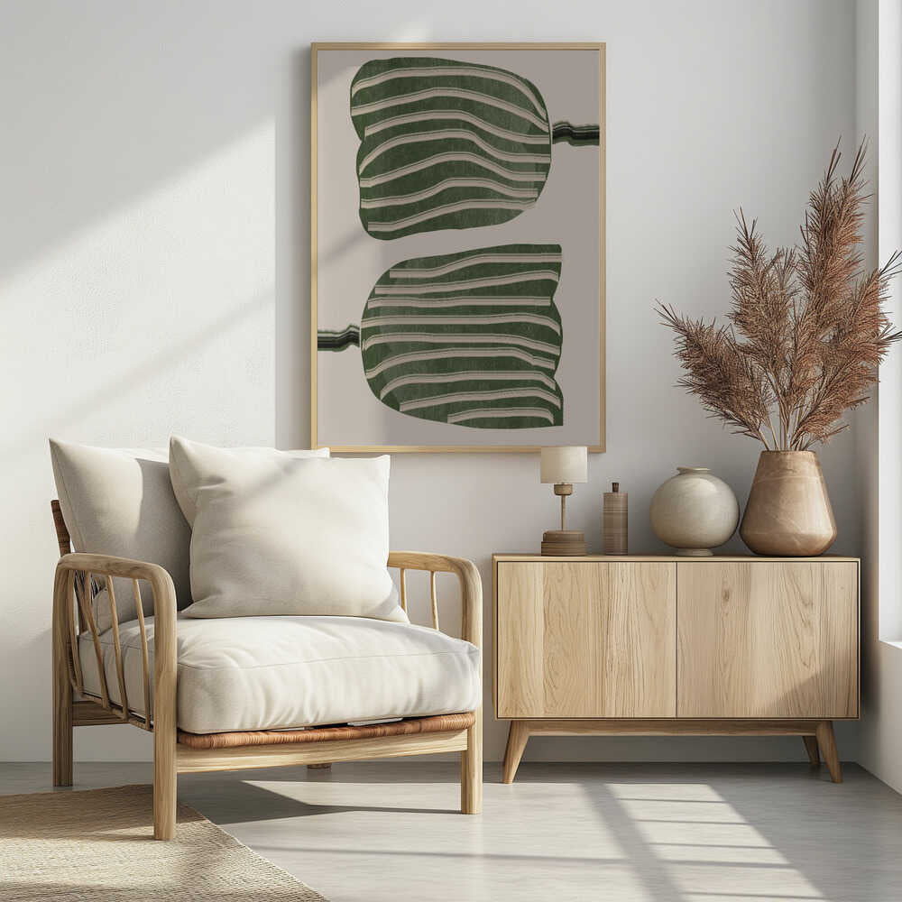 A framed abstract artwork featuring two large, organic, blob-like shapes stacked vertically. The shapes are dark green with wavy, horizontal cream-colored stripes. They are set against a solid cream background, with thin, distorted lines extending from the sides of each shape. Decor