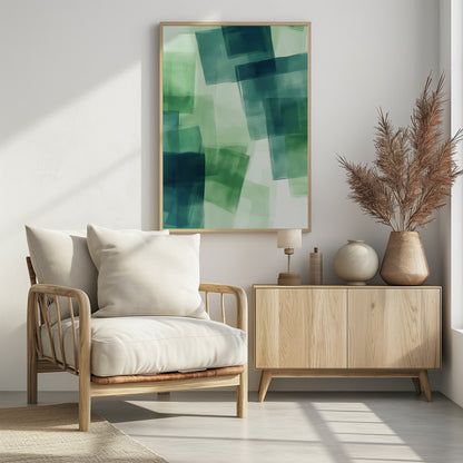 An abstract painting in a black frame, featuring overlapping, semi-transparent squares in shades of green and dark teal against a light green background, creating a layered, watercolor-like effect. Artwork