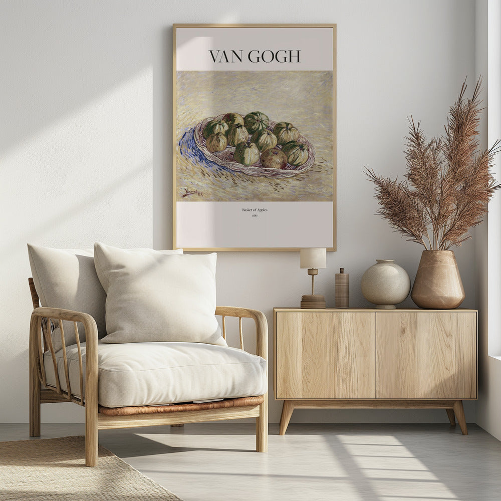 A framed art poster of Vincent van Gogh's 1887 painting, 'Basket of Apples'. The impressionist still life shows a woven basket filled with green and yellow apples on a textured, light yellow background. The poster includes the text 'VAN GOGH' at the top. Print