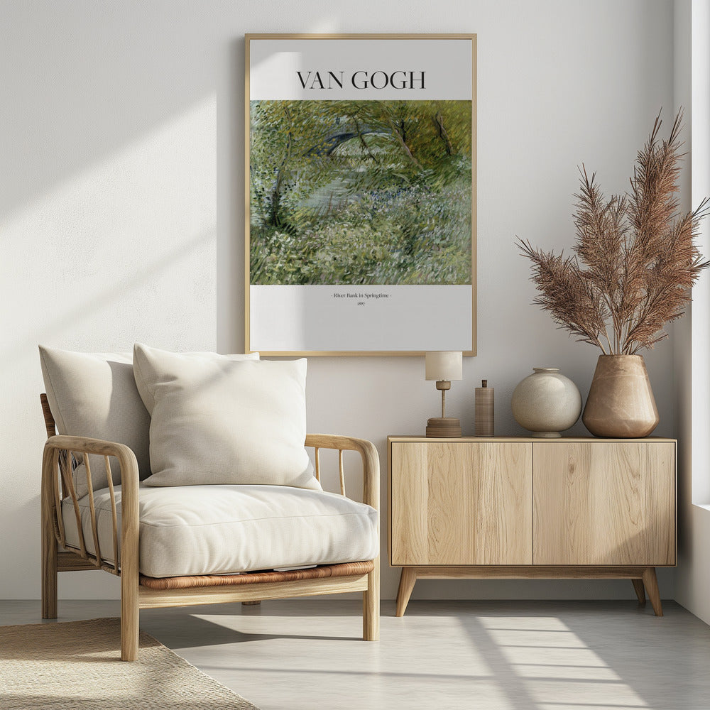 A framed poster of Vincent van Gogh's painting, 'River Bank in Springtime'. The impressionist artwork depicts a lush green landscape with a river and a stone bridge, painted with visible, textured brushstrokes. The title and artist's name are printed on a white border. Artwork