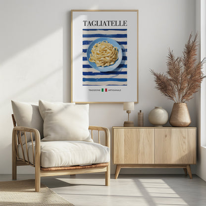 A vintage-style art print of a blue plate filled with tagliatelle pasta, set against a blue and white striped background. The word 'TAGLIATELLE' is printed at the top, and 'TRADIZIONE ARTIGIANALE' with an Italian flag is at the bottom. Artwork