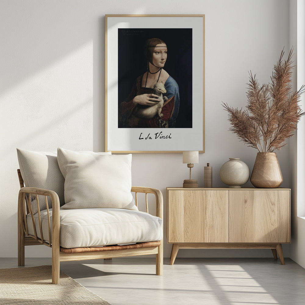 A framed art print of Leonardo da Vinci's painting, 'Lady with an Ermine'. The Renaissance portrait shows a woman holding a white ermine. The print has a white border with 'L da Vinci' signed at the bottom, mimicking a polaroid. Artwork
