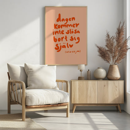 A framed poster with a motivational Swedish quote in a playful, bold orange font against a light peach background. The text reads 'dagen kommer inte slösa bort sig själv' and below it in parenthesis '(det är ditt jobb)', which translates to 'The day will not waste itself (it's your job)'. Wall Art