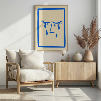 A minimalist framed illustration of a crying face. Bold blue lines on a cream background depict two closed eyes with long lashes, an L-shaped nose, and three large teardrops. The artwork is contained within a thick, hand-drawn blue border. Wall Art