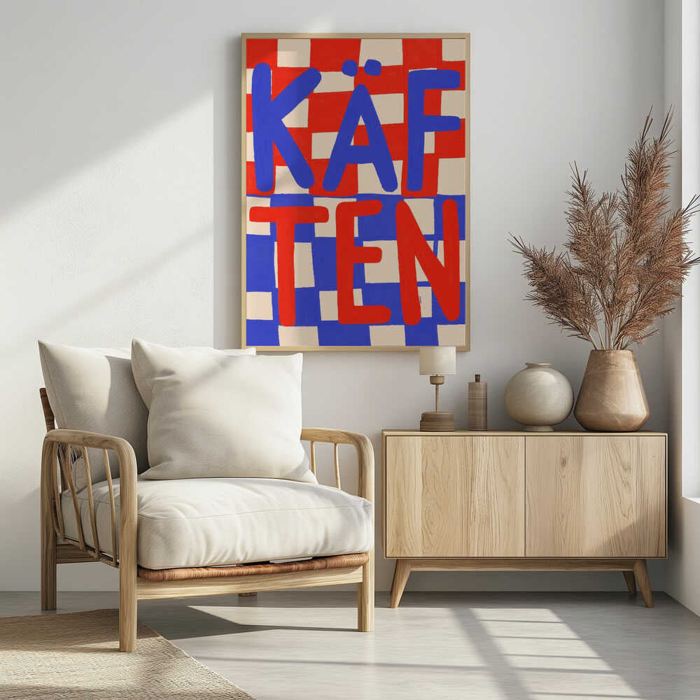 A bold graphic art print featuring the word 'KÄFTEN' split into two lines against a checkerboard background. The top line 'KÄF' is in blue text over a red and cream checker pattern. The bottom line 'TEN' is in red text over a blue and cream checker pattern. The style is playful and hand-painted, enclosed in a thin black frame. Wall Art
