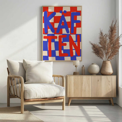 A bold graphic art print featuring the word 'KÄFTEN' split into two lines against a checkerboard background. The top line 'KÄF' is in blue text over a red and cream checker pattern. The bottom line 'TEN' is in red text over a blue and cream checker pattern. The style is playful and hand-painted, enclosed in a thin black frame. Wall Art