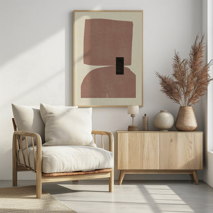 A minimalist abstract art print in a black frame, featuring two large, textured dusty-rose shapes stacked vertically against a cream background. The top shape is an irregular rectangle and the bottom is a dome shape, with a small black rectangle overlapping them in the center. Decor