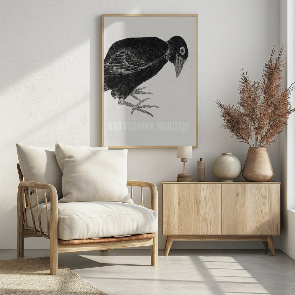 A black and white Japanese woodblock print by Katsushika Hokusai from 1814. The artwork features a stylized black crow with a textured, inky appearance, bending its head down against a light, grainy background. The piece is framed in black. Decor