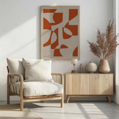 A framed abstract art piece with bold, burnt-orange shapes that are both curved and angular, overlapping on a textured, light beige background. A simple signature is in the bottom-left corner. Poster