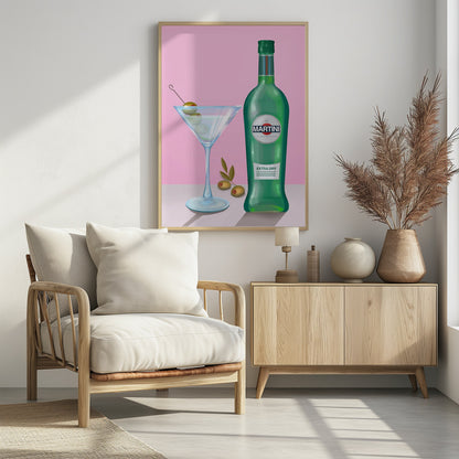 A stylized illustration of a green bottle of Martini Extra Dry vermouth next to a classic martini glass filled with a clear cocktail and garnished with three green olives on a pick. The scene is set on a light grey surface against a solid pink background, all enclosed in a thin black frame. Poster