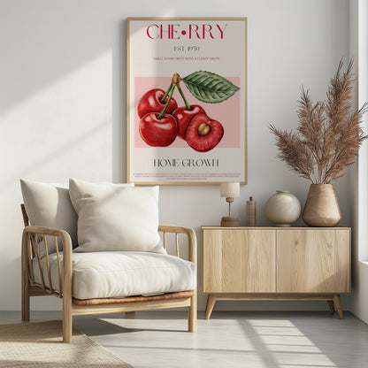 A vintage-style botanical poster of cherries with a black frame. The poster features a detailed illustration of four red cherries on a pink background. Above the illustration, the word 'CHERRY' is printed in large magenta letters, with 'EST. 1959' below it. At the bottom, it says 'HOME GROWN' in green, followed by a descriptive paragraph about cherries on a cream background. Poster