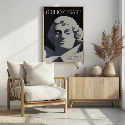 A minimalist, Art Deco-style poster for the opera 'Giulio Cesare' by Georg Friedrich Händel. It features a stylized, sculptural portrait in shades of grey against a solid black background, characterized by strong, graphic shadows. The title 'GIULIO CESARE' is at the top in white, and the composer's name is at the bottom right. Artwork