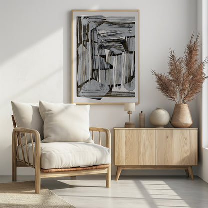 An abstract artwork in a black frame, featuring a dynamic collage of layered shapes and energetic brushstrokes in a neutral palette of gray, black, beige, and white. Artwork