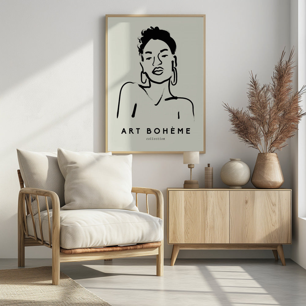 A framed minimalist art print featuring a black ink line drawing of a woman with curly hair and hoop earrings on a beige background. The text 'ART BOHÈME collection' is printed below the portrait. Poster