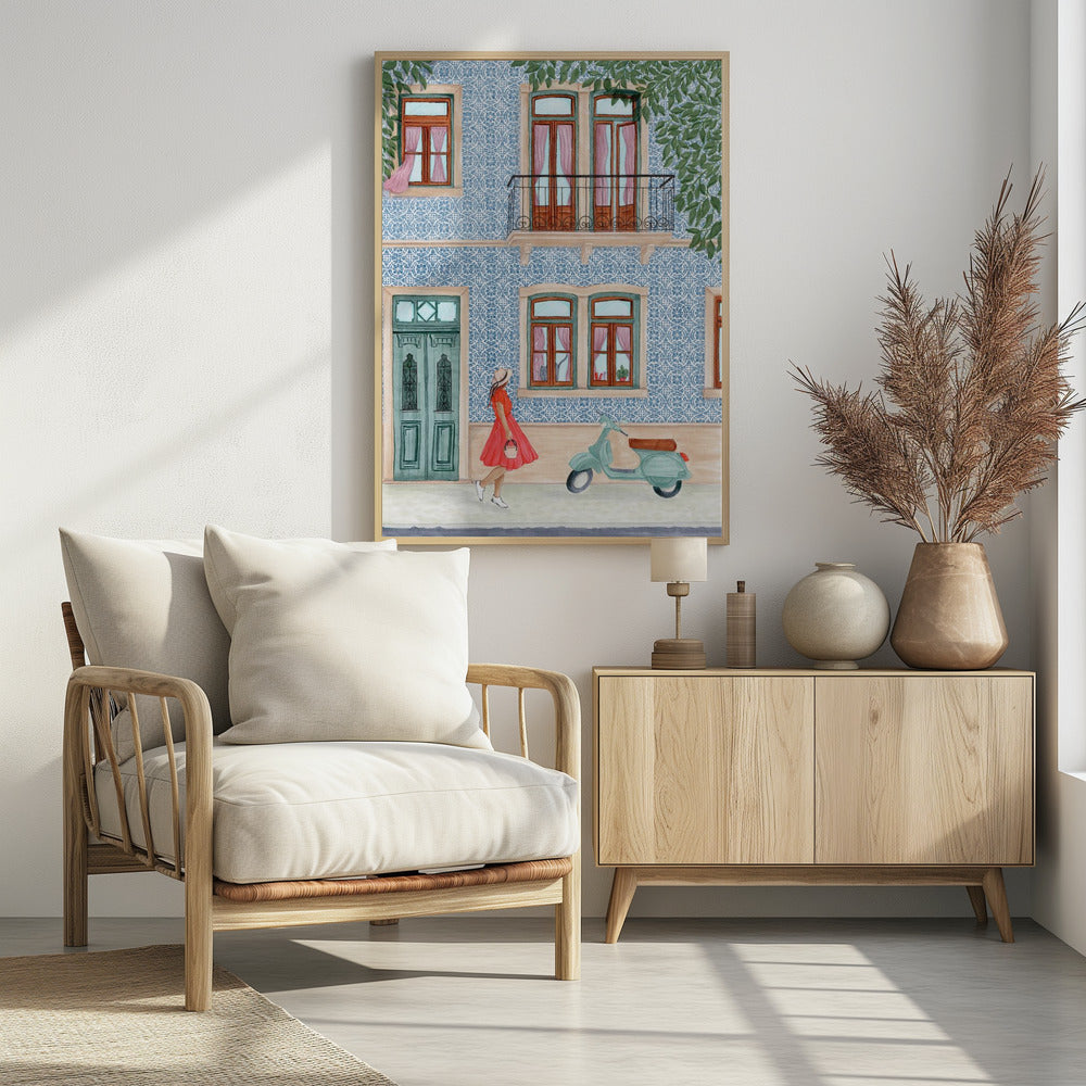 A watercolor illustration of a woman in a red dress and sun hat walking past a building with a blue and white patterned tile facade. A light green scooter is parked on the sidewalk, and the building features wooden windows with pink curtains, a teal door, and a second-story balcony. Print