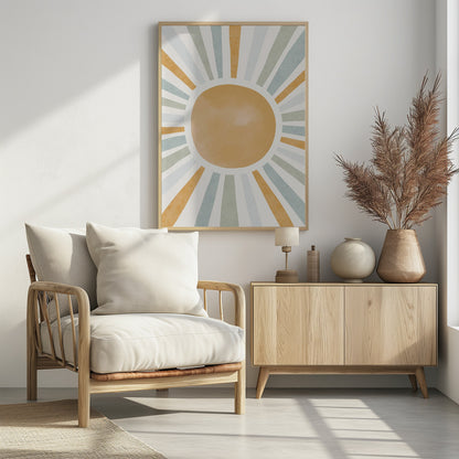 An abstract illustration of a large, mustard-yellow sun with radiating sunbeams. The beams are in alternating colors of yellow, sage green, and light blue, set against an off-white background. Wall Art