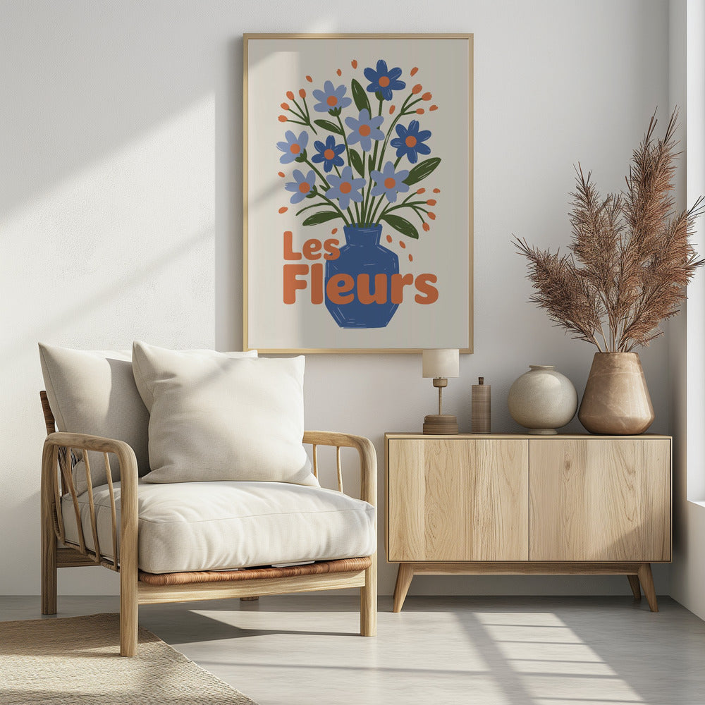 A stylized illustration of a blue vase filled with light and dark blue flowers with orange centers and green leaves. The phrase "Les Fleurs" is written in a bold orange font in the foreground, all set against a cream-colored background and framed in black. Decor