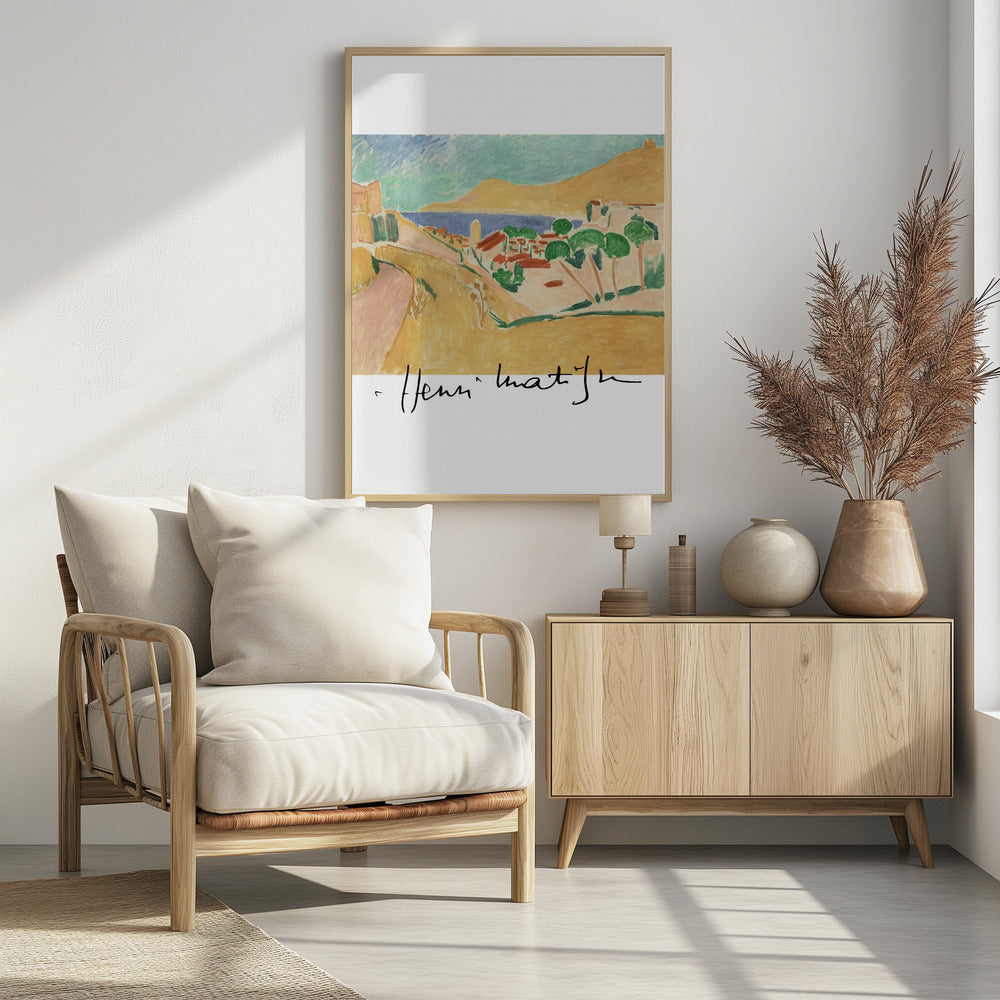 A framed art print of a Henri Matisse painting depicting a colorful coastal landscape in the Fauvist style. The scene features ochre hills, a blue sea, and a village with red-roofed houses and green trees, with the artist's signature at the bottom. Wall Art