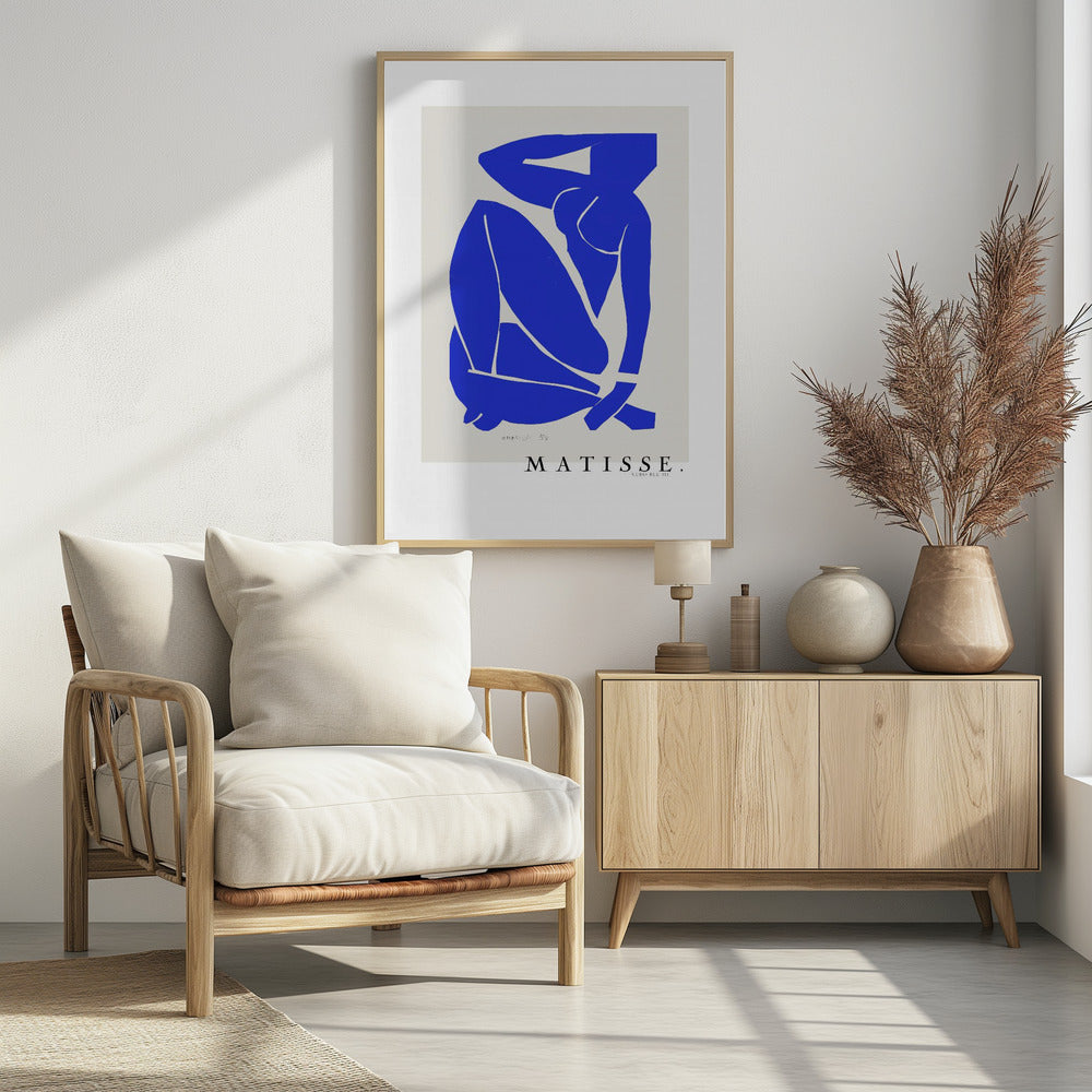 A framed art print of Henri Matisse's 'Blue Nude III', featuring a vibrant blue paper cut-out of a seated nude woman against an off-white background. Poster