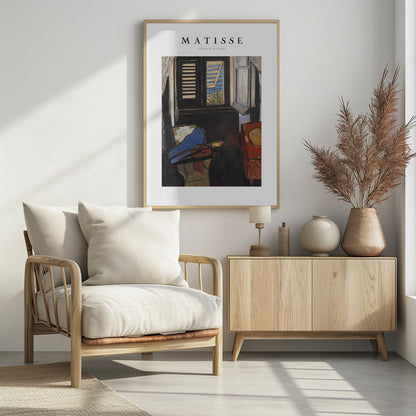 A framed poster of Henri Matisse's painting 'Intérieur au Violon'. The artwork depicts a dimly lit room with a violin resting on its open, vibrant blue case in the foreground. An open window in the background reveals a bright, sunny seascape. Poster