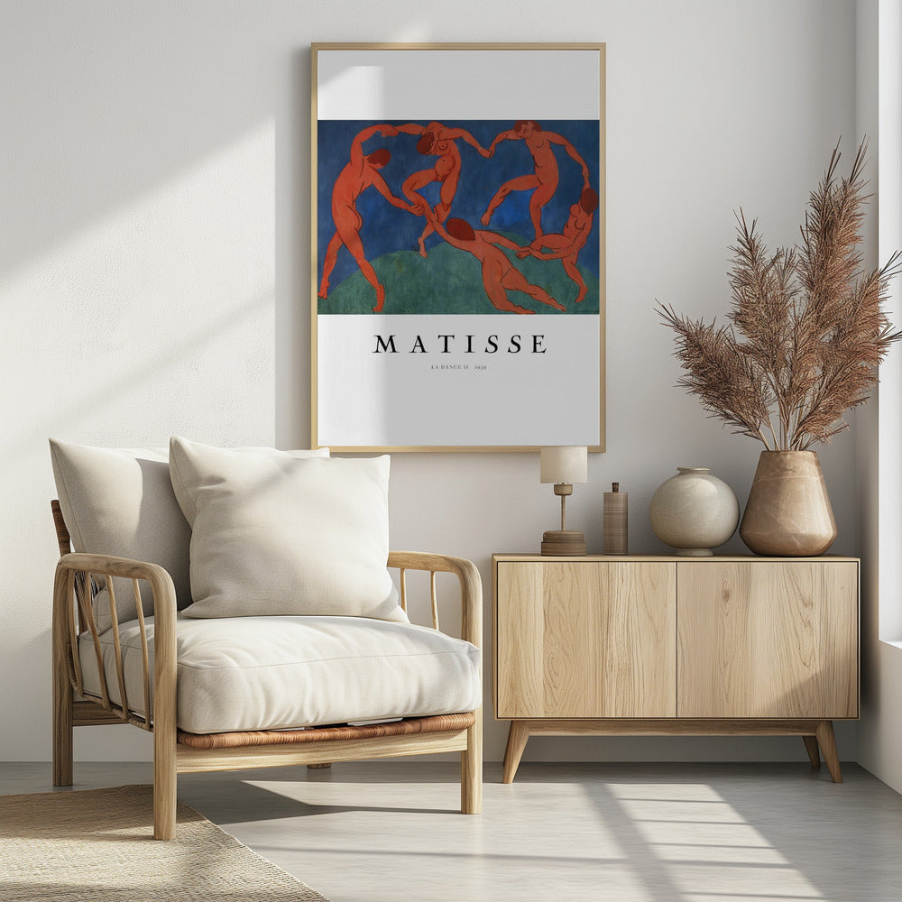 A poster of Henri Matisse's famous painting 'La Danse II', featuring five nude, reddish-orange figures dancing joyfully in a circle against a stark background of deep blue sky and green earth. The poster has a white border with 'MATISSE' and the title and year printed below the artwork, all within a black frame. Wall Art