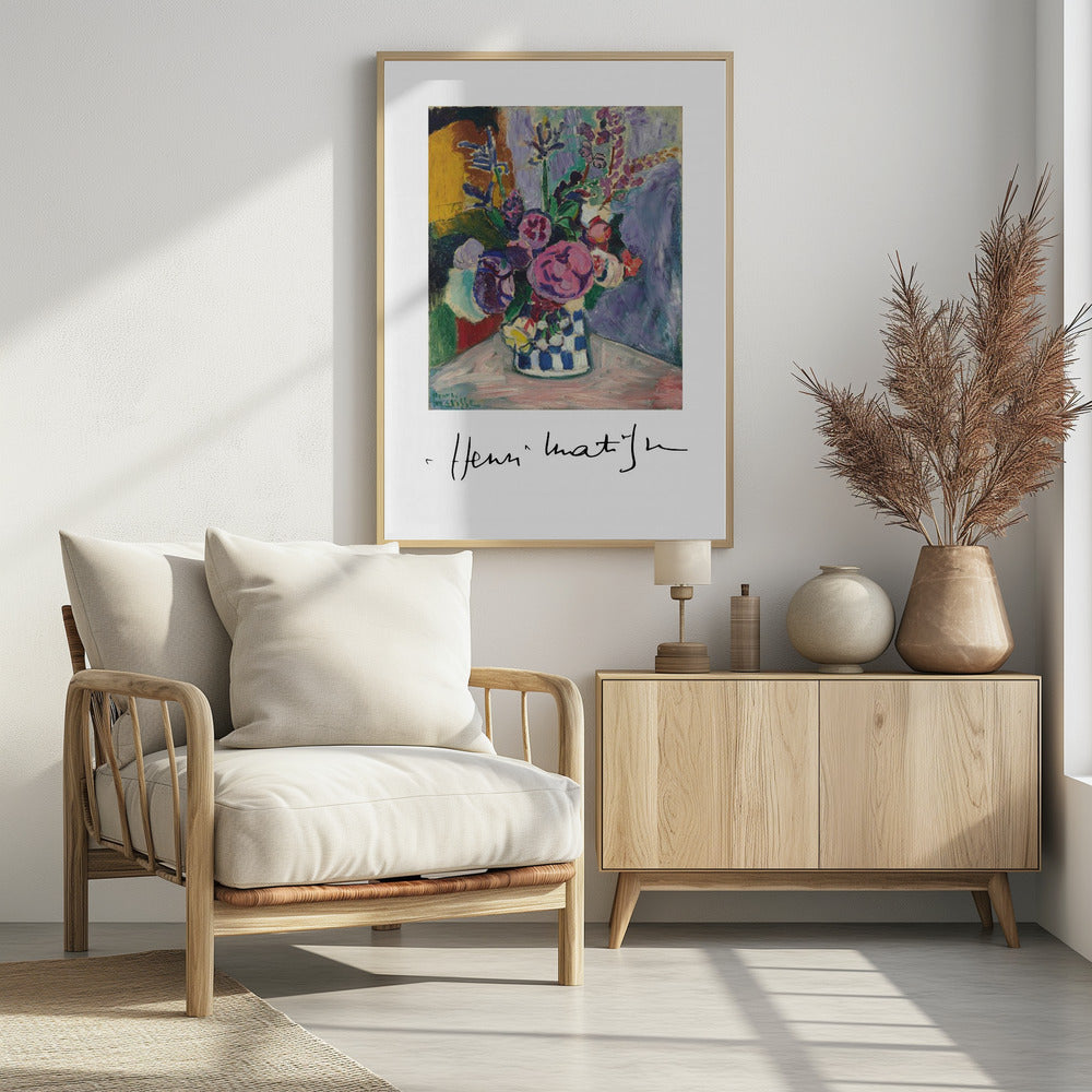 A framed art print of a vibrant Henri Matisse painting. The still life features a bouquet of colorful pink, purple, and white flowers in a blue and white checkered vase, set against a multi-toned background. The artist's signature is displayed below the painting on the white mat. Print