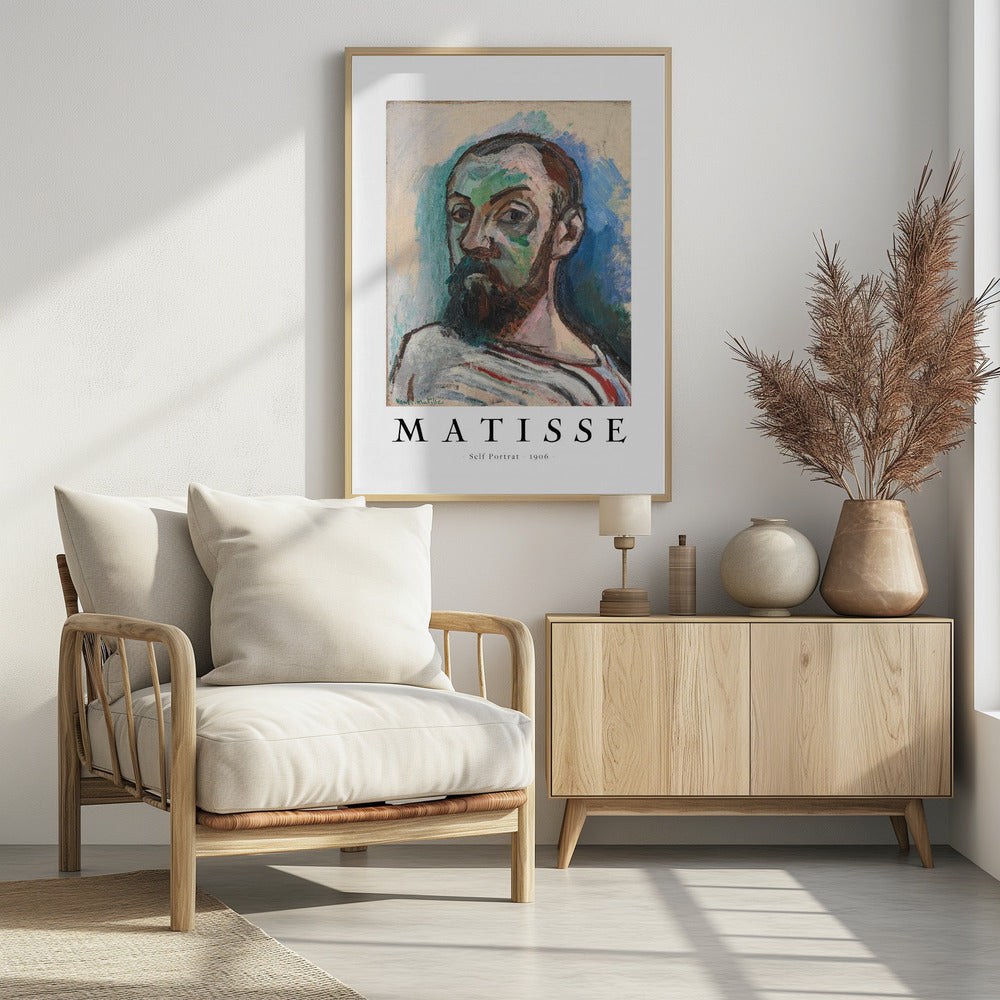 A framed art print of Henri Matisse's 'Self Portrait' from 1906. The Fauvist painting features a man with a dark beard, rendered in bold strokes of green, beige, and brown, against a vibrant blue and light green background. Below the artwork, text reads 'MATISSE - Self Portrait - 1906'. Wall Art