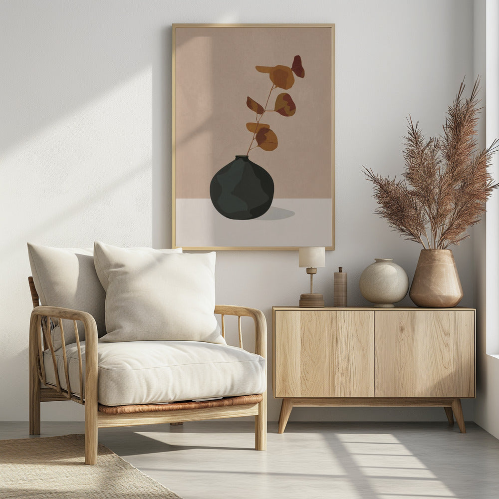 A minimalist illustration of a single eucalyptus stem with rust and orange colored leaves in a dark, matte, rounded vase. The vase sits on a light-colored surface against a solid beige background, creating a simple and modern composition with earthy tones. Wall Art
