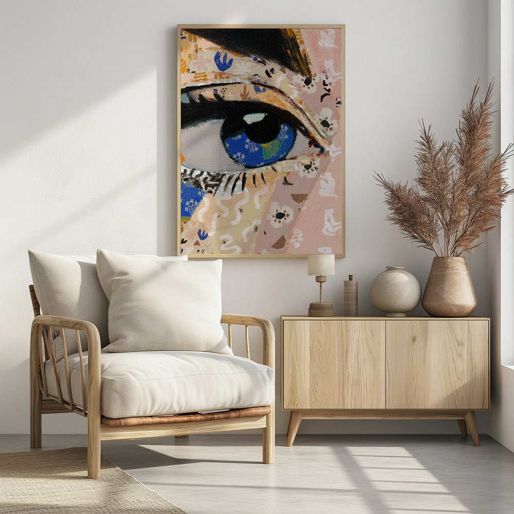 A vibrant mixed-media collage painting focusing on a large human eye. The iris is a deep blue filled with tiny white flower patterns, while the surrounding skin is a patchwork of pink and beige papers with various abstract and floral motifs. The eye is framed by thick black eyeliner. Wall Art