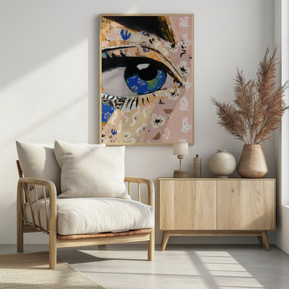 A vibrant mixed-media collage painting focusing on a large human eye. The iris is a deep blue filled with tiny white flower patterns, while the surrounding skin is a patchwork of pink and beige papers with various abstract and floral motifs. The eye is framed by thick black eyeliner. Wall Art